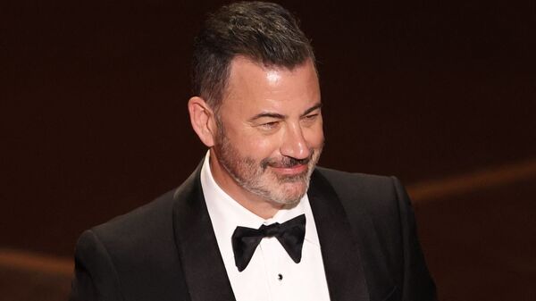 “I hope those of you who watch our show will also tune into CBS for the last time,” televison host Jimmy Kimmel said. (In pic: Kimmel presents the award for Best Documentary Short Film onstage during the 98th Annual Academy Awards at the Dolby Theatre in Hollywood, California on March 15, 2026. (Photo by Patrick T. Fallon / AFP))