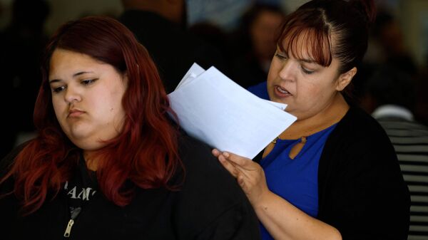 INGLEWOOD, CALIFORNIA - APRIL 28: A job seeker fills out an application during the HIRE360 Diversity Hiring Expo on April 28, 2026 in Inglewood, California. U.S. jobless claims rose by 6,000 to 214,000 in the latest week, coming in above expectations but remaining at relatively low levels, signaling continued labor market stability despite a slight uptick in layoffs.   Justin Sullivan/Getty Images/AFP (Photo by JUSTIN SULLIVAN / GETTY IMAGES NORTH AMERICA / Getty Images via AFP)