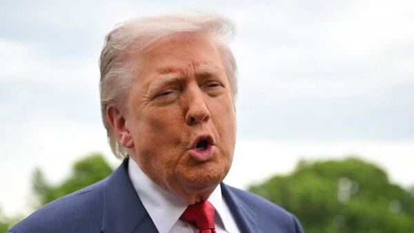 US President Donald Trump speaks to journalists as he makes his way to board Marine One before departing from the South Lawn of the White House in Washington, DC on May 8, 2026.  (Photo by Mandel NGAN / AFP)