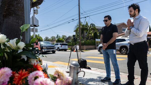 Community members mourn for the victims a day after a shooting at the Islamic Center of San Diego, California, on May 19, 2026. (Photo by Zo Meyers / AFP)