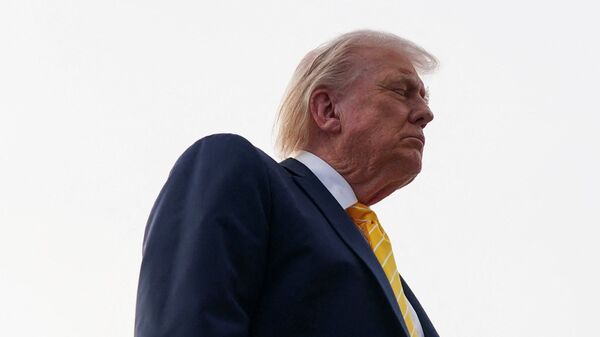 US President Donald Trump speaks to the media before boarding Air Force One for departure to Miami, Florida, at Palm Beach International Airport in West Palm Beach, Florida, U.S., May 2, 2026.
