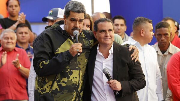 FILE - Venezuela's President Nicolas Maduro, left, and Alex Saab stand together during an event marking the anniversary of the 1958 coup that overthrew dictator Marcos Perez Jimenez, in Caracas, Venezuela, Jan. 23, 2024