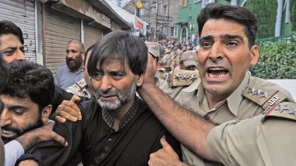 FILE: Jammu and Kashmir Liberation Front (JKLF) Chairman Yasin Malik detained by police as he try to march towards the office of the United Nations Military Observers Group in India and Pakistan (UNMOGIP) in Srinagar. The restrictions were imposed to foil a separatists UN March against alleged civilian killings in Kashmir valley, according to local news reports.(Photo by Waseem Andrabi / Hindustan Times)