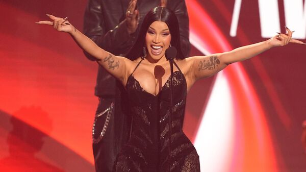 Cardi B accepts the award for best female hip hop artist during the BET Awards on Sunday.