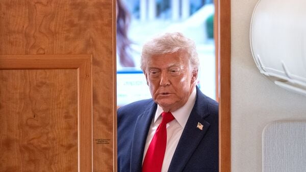 President Donald Trump arrives to speak to reporters aboard Air Force One en route from Joint Base Andrews, Md., to Eau Claire, Wis., Friday, June 5, 2026. AP/PTI