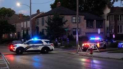 Toledo festival shooting:: Police stand near where multiple people were shot at a community festival at the Agnes Reynolds Jackson Arboretum Saturday, June 6, 2026, in Toledo, Ohio. (AP/PTI) (AP) Toledo festival shooting:: Police stand near where multiple people were shot at a community festival at the Agnes Reynolds Jackson Arboretum Saturday, June 6, 2026, in Toledo, Ohio. (AP/PTI) (AP)