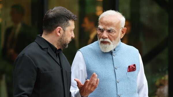 Ukraine's President Volodymyr Zelensky, left, and India's Prime Minister Narendra Modi speak before a family photo during a gala dinner as part of the G7 summit, in Evian-les-Bains, France, Tuesday June 16, 2026. AP/PTI(AP06_17_2026_000016B)