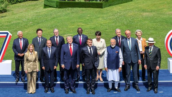 From left, European Council President Antonio Costa, Italian Prime Minister Giorgia Meloni, South Korea's President Lee Jae Myung, Egyptian President Abdel-Fattah el Sissi, British Prime Minister Keir Starmer, U.S. President Donald Trump, Kenya's President William Ruto, French President Emmanuel Macron Japan's Prime Minister Sanae Takaichi, India's Prime Minister Narenda Modi, Canadian Prime Minister Mark Carney, German Chancellor Friedrich Merz, European Commission President Ursula von der Leyen and Brazil's President Luiz Inacio Lula da Silva pose during a group photo of G7 leaders