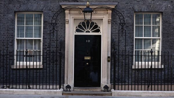 The door to 10 Downing Street is pictured in London, on the morning of June 19, 2026, with a formal challenge to Britain's Prime Minister Keir Starmer likely to be triggered in the near future. Veteran UK Labour politician Andy Burnham emphatically won a crunch by-election on Friday, securing a parliamentary seat and clearing the way for a widely expected leadership challenge against beleaguered Prime Minister Keir Starmer. (Photo by Toby Shepheard / AFP)