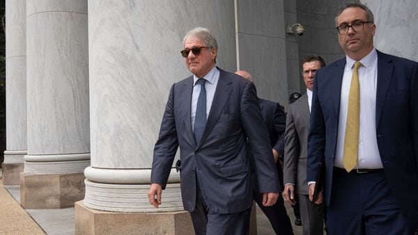 Leon Black, left, walks out of the Rayburn House Office Building at the Capitol after he cut short his interview about Epstein with the House Oversight Committee, in Washington, Friday, June 26, 2026. (AP Photo/J. Scott Applewhite)