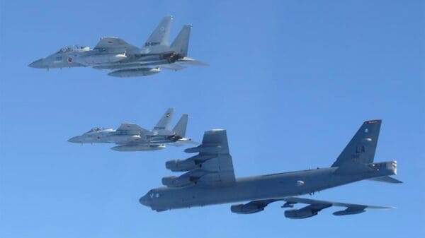 A US Air Force B-52 strategic bomber and two Japan Air Self-Defense Force F-15 fighter jets conducting a joint exercise over the Sea of Japan. (Photo by Handout / Japan's Ministry of Defense/AFP)
