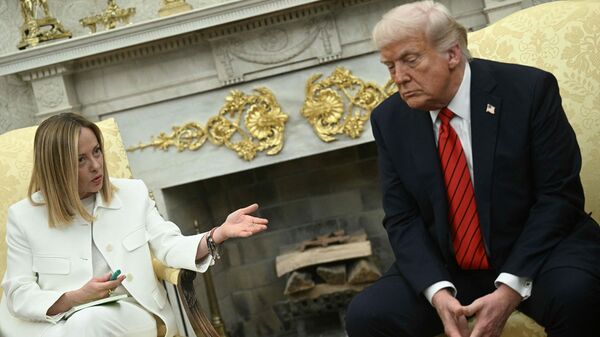 (FILES) US President Donald Trump meets with Italian Prime Minister Giorgia Meloni in the Oval Office of the White House in Washington, DC, on April 17, 2025. Trump insists on June 20, 2026 Italian PM Meloni 'asked, over and over' for photo with him at G7. (Photo by Brendan SMIALOWSKI / AFP)