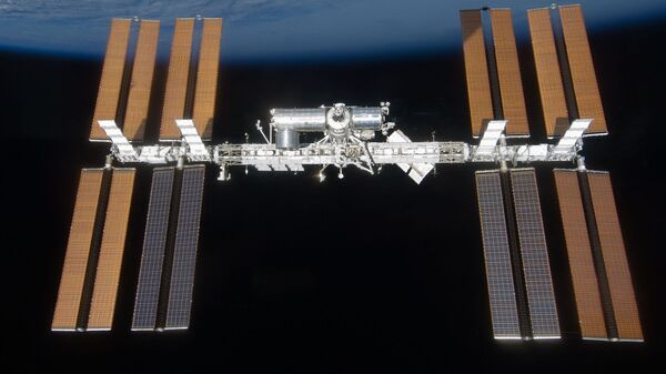 (FILES) This handout image released by NASA shows the International Space Station on March 25, 2009 as seen from the US space shuttle Discovery. (Photo by Handout / NASA / AFP)