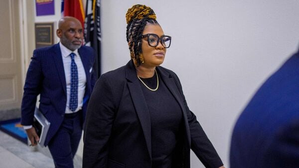 WASHINGTON, DC - MAY 18: Former prison guard Tova Noel (C) returns from a break from testifying at a closed-door interview with the House Oversight Committee on Capitol Hill on May 18, 2026, in Washington, DC. Andrew Harnik/Getty Images/AFP