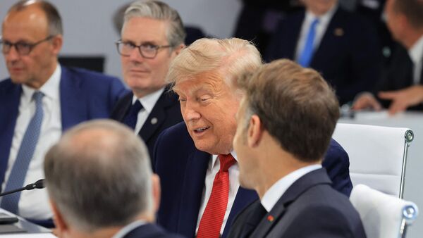 (From L) Germany's Chancellor Friedrich Merz, Britain's Prime Minister Keir Starmer, US President Donald Trump and France's President Emmanuel Macron attend a morning work meeting of the G7 countries, partner countries on June 17, 2026. (Photo by Ludovic MARIN / AFP)