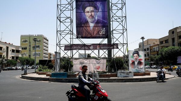 People ride past a banner with a picture of Iran's Supreme Leader, Mojtaba Khamenei, in Tehran, Iran, June 28, 2026. Majid Asgaripour/WANA (West Asia News Agency) via REUTERS