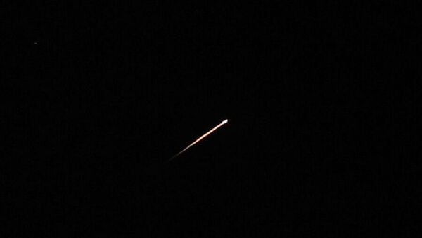 A streak of light illuminates the sky during a missile attack from Iran towards Israel, as seen from Jerusalem, June 7, 2026. REUTERS/Ammar Awad