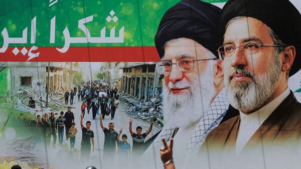 A man flashes a victory sign as he rides a motorcycle past a banner that reads 'Thank you Iran' following a deal between the U.S. and Iran, in the southern suburbs of Beirut, Lebanon, June 15, 2026.REUTERS/ Mohamed Azakir