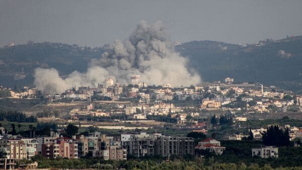 A photograph taken from the Tyre region of southern Lebanon shows smoke rising from the site of Israeli airstrikes that targeted the village of Rmadiyeh in the Tyre district of southern Lebanon on May 26, 2026.