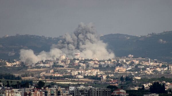 A photograph taken from the Tyre region of southern Lebanon shows smoke rising from the site of Israeli airstrikes that targeted the village of Rmadiyeh in the Tyre district of southern Lebanon on May 26, 2026. Israel has repeatedly bombed Lebanon despite a truce in its war with Hezbollah