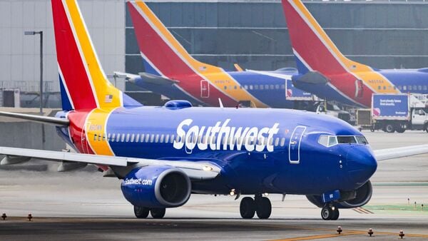 FILE - A Southwest Airlines plane is on the runway at Los Angeles International Airport on March 23, 2026, in Los Angeles. (AP Photo/Ethan Swope, File)