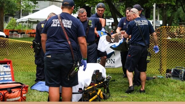 TPD investigates a shooting that left 12 people injured at the Old West End Festival at the Agnes Reynolds Jackson Arboretum in Toledo, Ohio, on Saturday, June 6, 2026. (Rebecca Benson/The Blade via AP)