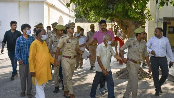 Police taking the accused to court in Ayodhya on Friday. (PTI PHOTO)