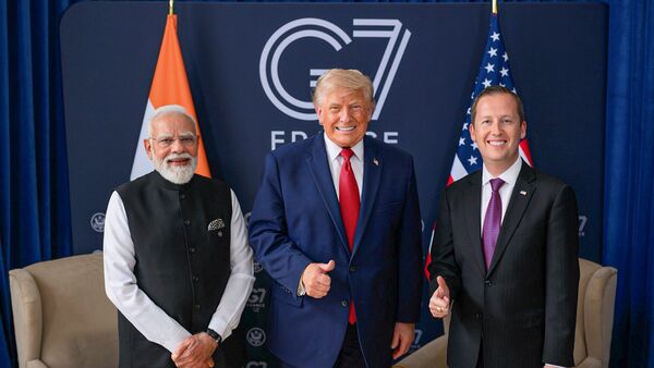Prime Minister Narendra Modi, US President Donald Trump and US Ambassador to India Sergio Gor during a meeting on the sidelines of the G7 Summit, in France. (@USAmbIndia/X via PTI Photo)