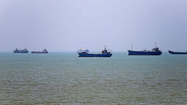 In this picture obtained from Iran's ISNA news agency on June 18, 2026, vessels are seen anchored in Bandar Abbas along the Strait of Hormuz. (Photo by AMIRHOSSEIN KHORGOOEI / ISNA / AFP) /
