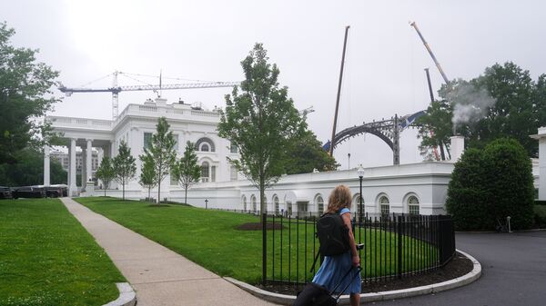 A construction crane continues work on the White House Ballroom
