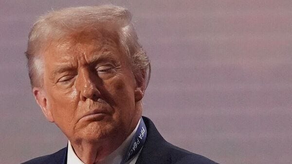 President Donald Trump stands on stage after receiving the FIFA Peace Prize during the draw for the 2026 soccer World Cup at the Kennedy Center in Washington, Dec. 5, 2025.