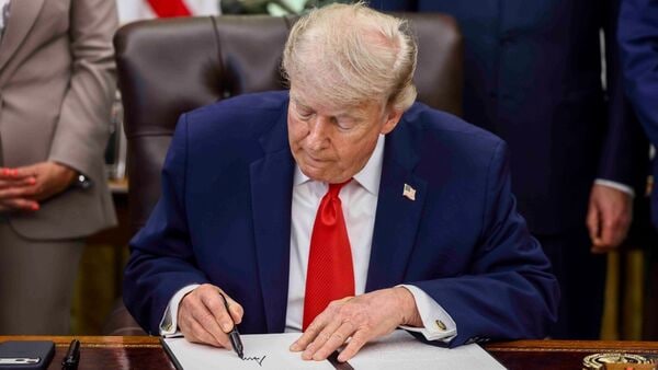 US President Donald Trump signs a proclamation in the Oval Office of the White House in Washington, DC, US, on Thursday, June 11, 2026. Trump pulled back threatened military strikes against Iran, a stark reversal that came just hours after he vowed to hit the Islamic Republic 'VERY HARD'.