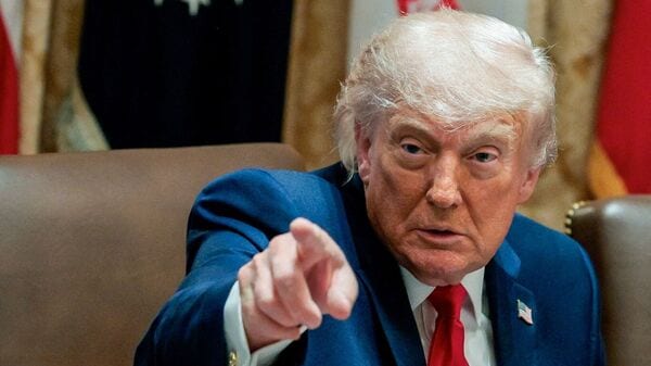 FILE PHOTO: Donald Trump's overall job approval rating stands at 37%, unchanged from an AP-NORC poll conducted in May.