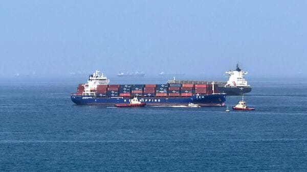 Latest news on June 29, 2026: A cargo ship is pictured off coast of the Khor Fakkan Container Terminal, the only natural deep-sea port in the region and one of the major container ports in Sharjah Emirate, along the Gulf of Oman on June 28, 2026. (Photo by AFP) /