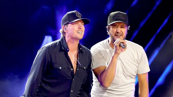 George Birge and Luke Bryan perform onstage at Nissan Stadium during CMA Fest 2026 day three on June 7