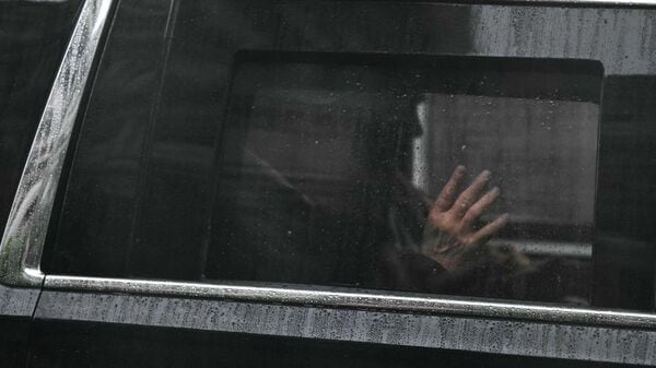 US President Donald Trump waves as he rides in his motorcade as it departs the White House in Washington, DC, on June 28, 2026. (Photo by Kent NISHIMURA / AFP)