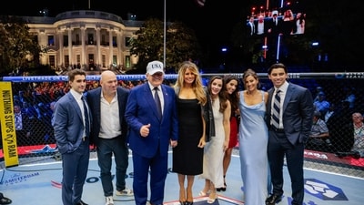 US President Donald Trump, US First Lady Melania Trump, UFC CEO Dana White and other guests stand inside the Octagon at UFC Freedom 250 on the South Lawn of the White House in Washington, DC, on June 15, 2026. (Photo by Evan Vucci / POOL / AFP) (AFP)