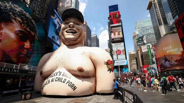 An inflatable effigy of SpaceX CEO Elon Musk, protesting Musk's Grok AI, stands in Times Square in New York City on June 11, 2026.
