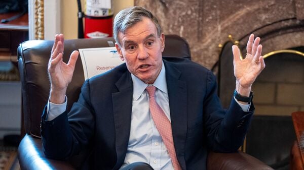 U.S. Senator Mark Warner (D-VA) speaks to the media during a Q&A on Capitol Hill in Washington, D.C., U.S. June 11, 2026. REUTERS/Ken Cedeno