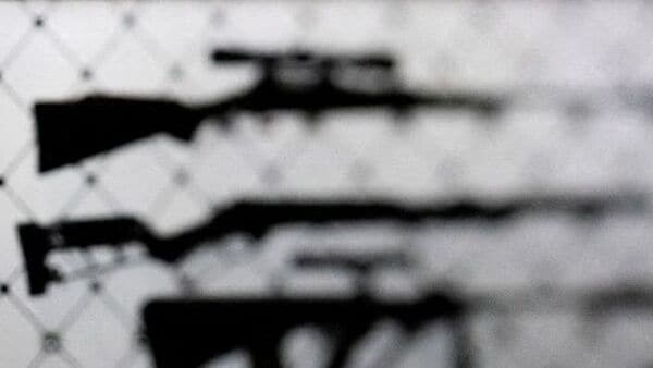 FILE PHOTO: AR-15 rifles are displayed at an exhibition booth during the National Rifle Association (NRA) annual convention in Dallas, Texas, U.S., May 18, 2024. Picture taken with a tilt-shift lens. REUTERS/Carlos Barria/File Photo