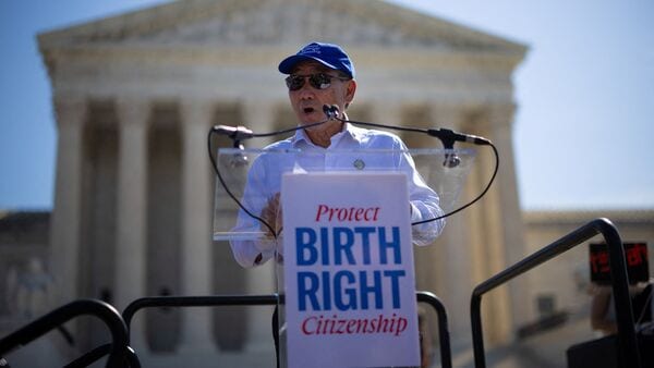 Norman Wong, the great-grandson of Wong Kim Ark, speaks during a demonstration outside the U.S. Supreme Court building on the day the court hears oral arguments on the legality of the Trump administration's effort to limit birthright citizenship for the children of immigrants, in Washington, D.C., U.S., April 1, 2026. REUTERS/Carlos Barria