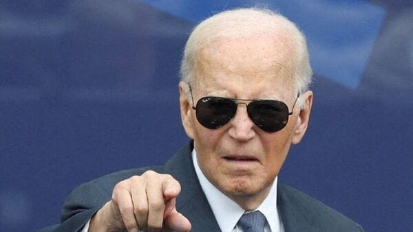 Former U.S. President Joe Biden gestures during a dedication ceremony for the opening of the Obama Presidential Center, in Chicago, Illinois, U.S., June 18, 2026. REUTERS/Brendan McDermid
