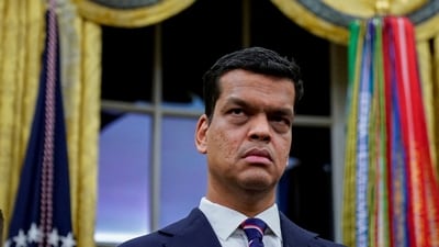 Sriram Krishnan, Senior White House Policy Advisor on Artificial Intelligence, listens prior to US President Donald Trump signing an executive order on AI in the Oval Office at the White House in Washington. (REUTERS)
