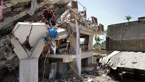 Latest news on June 28, 2026: Rescuers work on a collapsed building in Caraballeda, La Guaira state, Venezuela, on June 27, 2026, following earthquakes. (Photo by Mauricio VALENZUELA / AFP)