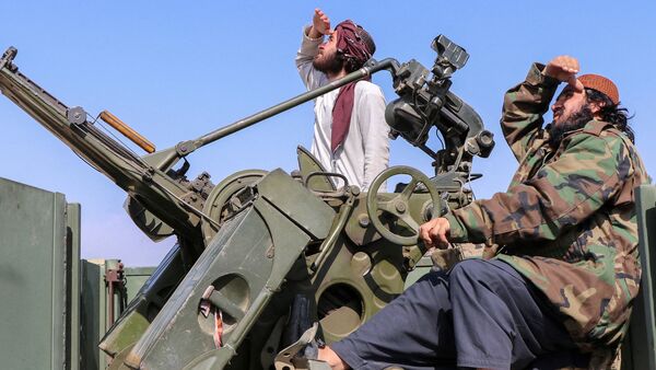 Taliban soldiers armed with an anti-aircraft gun while on lookout for Pakistan's fighter jets, in Afghanistan's Khost province on February 27.
