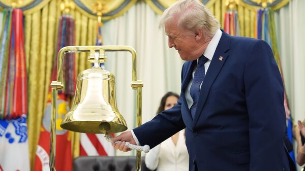President Donald Trump rings the opening bell for the New York Stock Exchange and the Nasdaq in the Oval Office at the White House, Monday, July 6, 2026, in Washington. (AP Photo/Mark Schiefelbein)