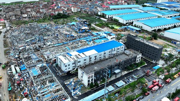 A drone view shows damaged buildings and vehicles at the site where a tornado struck, in Huanggang, Hubei province, China, on Tuesday, 7 July.