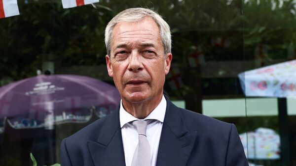 Leader of the Reform UK party Nigel Farage sits at a pub, after he announced on Tuesday that he has resigned as an MP, triggering a by-election in his parliamentary seat, where he intends to stand for re-election, in Great Bentley, Britain, July 8, 2026. R