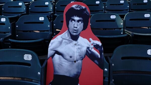 FILE - A cardboard cutout of martial artist Bruce Lee is displayed at Oracle Park before a baseball game between the San Francisco Giants and the San Diego Padres in San Francisco, July 30, 2020. (AP Photo/Jeff Chiu, File)