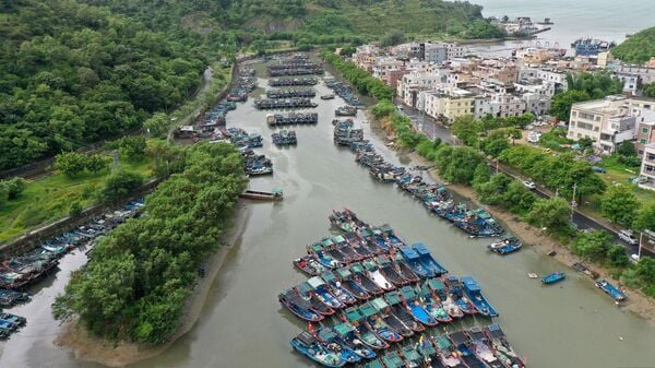 In this photo released by Xinhua News Agency, a drone photo shows fishing boats taking shelter ahead of Typhoon Noul at a port in Shenzhen-Shanwei Special Cooperation Zone in southern China's Guangdong Province on Saturday,  July 25, 2026. (Lu Hanxin/Xinhua via AP)
